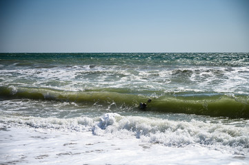Black Sea. Summer storm. Waves lapping at the sandy beach.