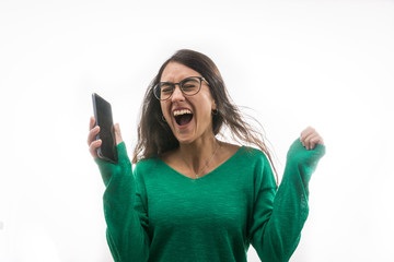 Naklejka premium Portrait of a super cheerful and excited girl when she sees a message