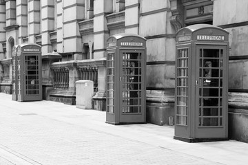 Great Britain telephone booths. Black and white vintage style.