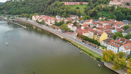 Fototapeta na wymiar Heidelberg Aerial View, Germany. Drone flying along Chain Bridge and main city landmarks