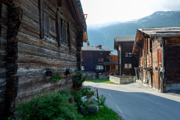 Street with old wooden houses in Oberwald / Obergoms / Wallis - obrazy, fototapety, plakaty