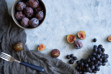 healthy fruits in assortment in plates grapes fig plums