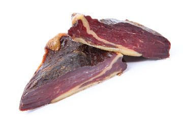 Slices of cured meat in a cut on a white background. View from above. Copy space. Isolated object...