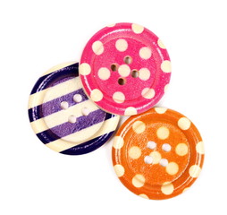 Colorful sewing buttons isolated on white background, top view