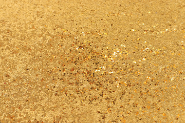 background of gold glitter lights. de focused
