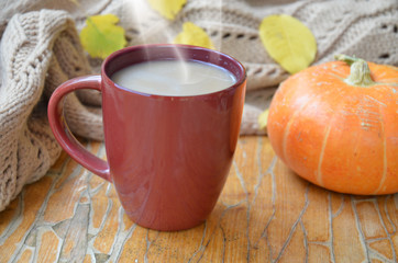 Pumpkin Spice Latte. Cup of Latte with Seasonal Autumn Spices, Cookies and Fall Decor. Traditional Coffee Drink for Autumn Holidays.
