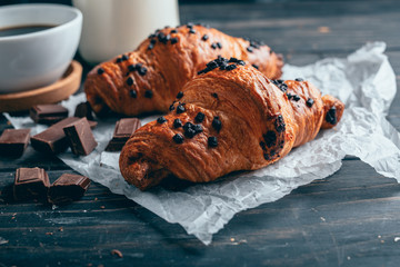 chocolate croissants on wooden table