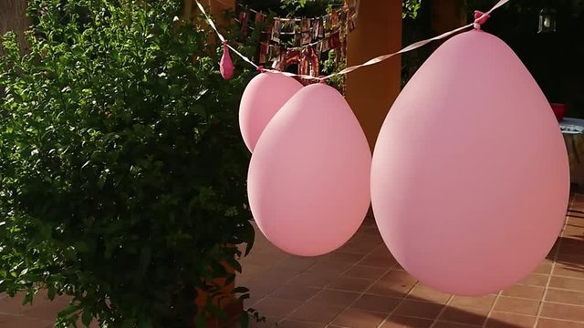 Everything prepared for the 60th anniversary party with pink balloons