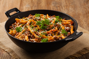 Maccheroni al ferretto with beef in ragu bolognese. Front view.