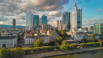 Fototapeta premium Frankfurt / Main Skyline Aerial Drone Shot At Sunset, widok wzdłuż rzeki