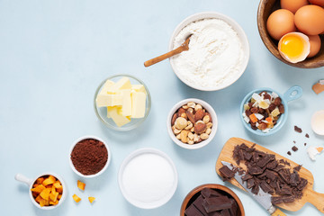 Dough preparation recipe cake, brownie, muffins, cupcakes ingridients, food flat lay on light background, text space. Working with butter, chocolate, cocoa, flour, eggs, fruits, nuts, bakery cooking.