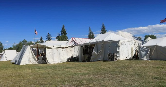 Fort Bridger Mountain Man rendezvous aspen trees tents. 19th century fur trading outpost on Oregon, California, and Mormon Trail. Pioneer, wilderness, camping and old trapper skills.