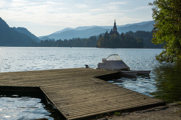 Travailing around  Lake Bled In Slovenia an amazing lake full of impressive nature , crystal blue water with a beautiful island in the middle surrounded by those beautiful mountains and trees. 