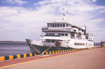 Tourist boat in the waterfront harbor.
