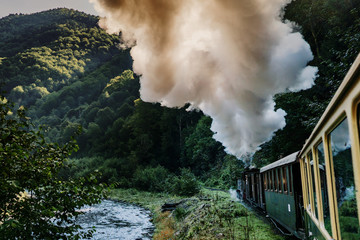 Fototapeta na wymiar Coal wood burning steam locomotive of Mocanita, popular tourist attraction in Maramures, Romania