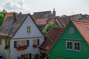 Typical wooden houses in this beautiful romantic town surrounded by red roofs. Photograph taken in Rothenburg ob der Tauber, Bavaria, Germany.