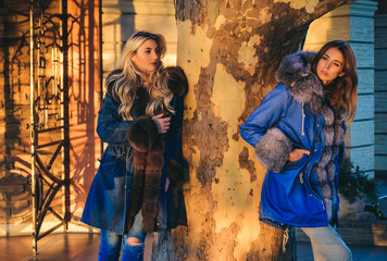 Autumn fashion trend. Fashion outdoor photo of gorgeous sensual models in elegant luxurious coat....