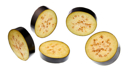 Flying eggplant slices isolated  on a white background