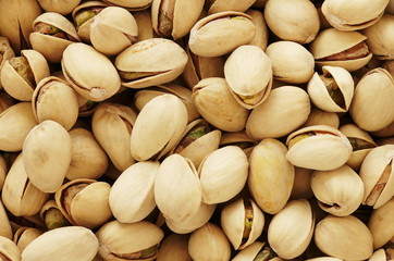 pistachios nuts close up full frame texture background. 