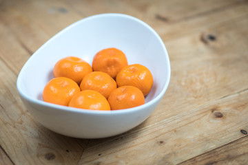 fresh and ripe mandarins in a white plate