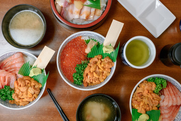 Top view of seafood Japanese sashimi rice bowls