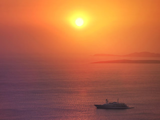 Fototapeta na wymiar Zoom photo of sunrise over the Aegean blue sea with beautiful colours
