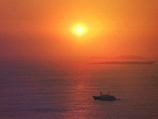 Naklejka na ściany i meble Zoom photo of sunrise over the Aegean blue sea with beautiful colours