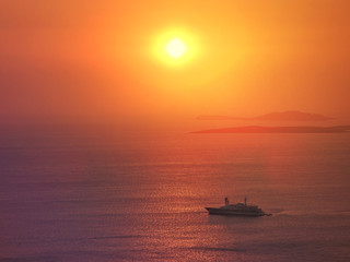 Fototapeta na wymiar Zoom photo of sunrise over the Aegean blue sea with beautiful colours