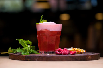 Alcoholic cocktail with raspberry