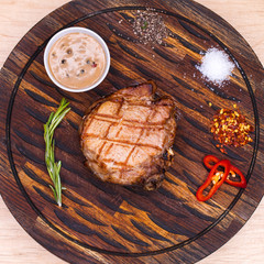 Pork steak on a wooden board