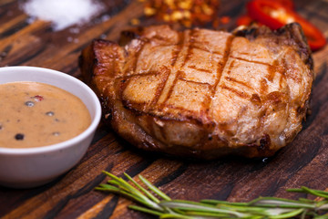 Pork steak on a wooden board