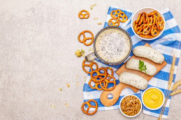 Oktoberfest set. Dark beer, weisswurst, pretzels, mustard, spikelets of grain, hop