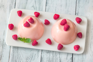 Dessert puddings with raspberries