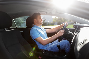 transport, vehicle and people concept - smiling man or driver driving car in summer