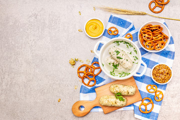 Oktoberfest set. White sausage weisswurst, pretzels, mustard, spikelets of grain, hop
