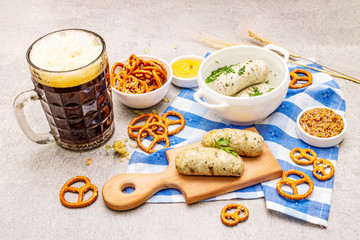 Oktoberfest set. Dark beer, weisswurst, pretzels, mustard, spikelets of grain, hop