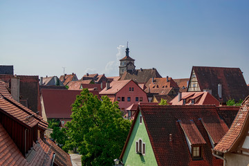 Fototapeta na wymiar Views of a lot of typical German houses in a beautiful skyline. Photograph taken in Rothenburg ob der Tauber, Bavaria, Germany.