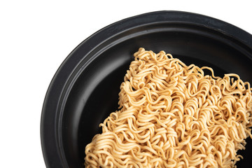 Instant noodles in a black Bowl. Isolated on white
