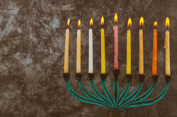 Jewish holiday Hanukkah with menorah traditional candelabra and Burning candles