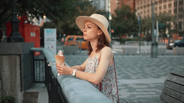 Attractive woman eating ice cream in New York