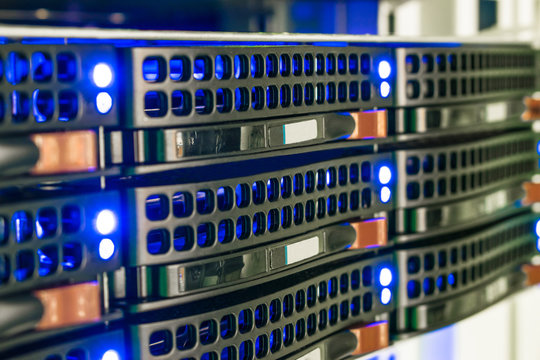 Computer hardware is on the hosting site of the Internet provider. Modern communication equipment is in the server room. Access server is a close-up. Cloud storage concept. Mining farm cryptocurrency.
