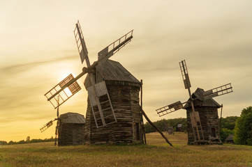 Fototapeta na wymiar Old wooden windmills Ukrainian style that were popular in the last century