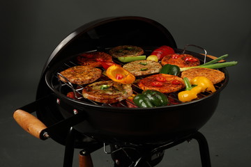 Grilled meat and vegetables. Grilled burgers and grilled vegetables.