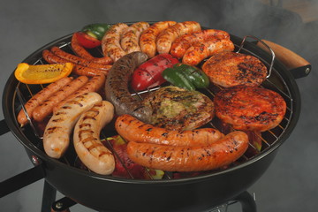 Grill. Sausage and meat fried on the grill.