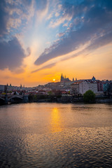 Fototapeta na wymiar Scenic View of the Old Town Architecture with Vltava River, Charles Bridge and St.Vitus Cathedral in Prague, Czech Republic, Sunset Time