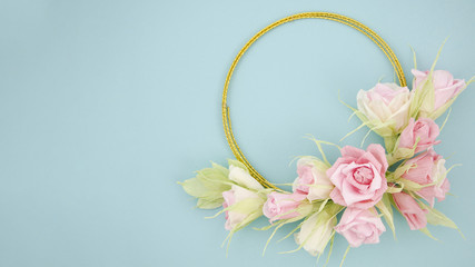 Floral frame on blue background with copy space