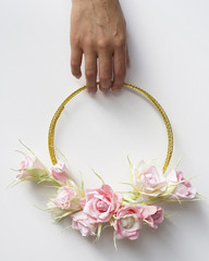 Front view woman holding a floral frame on white background