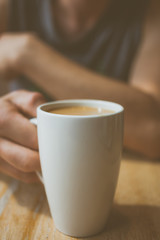hand with cup of coffee