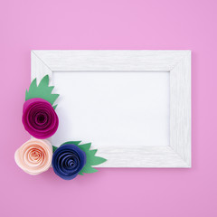 White floral frame on pink background