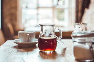 A Cup of Coffee on the Wooden Table in Modern Hipster Cosy Cafeteria